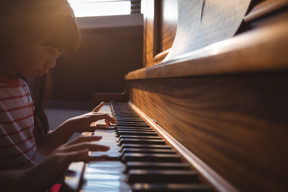 A girl playing a piano
